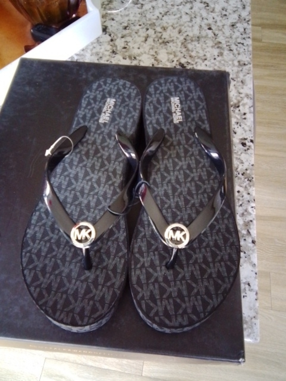 Michael Kors Black Flip Flops with Gold MK Medallions